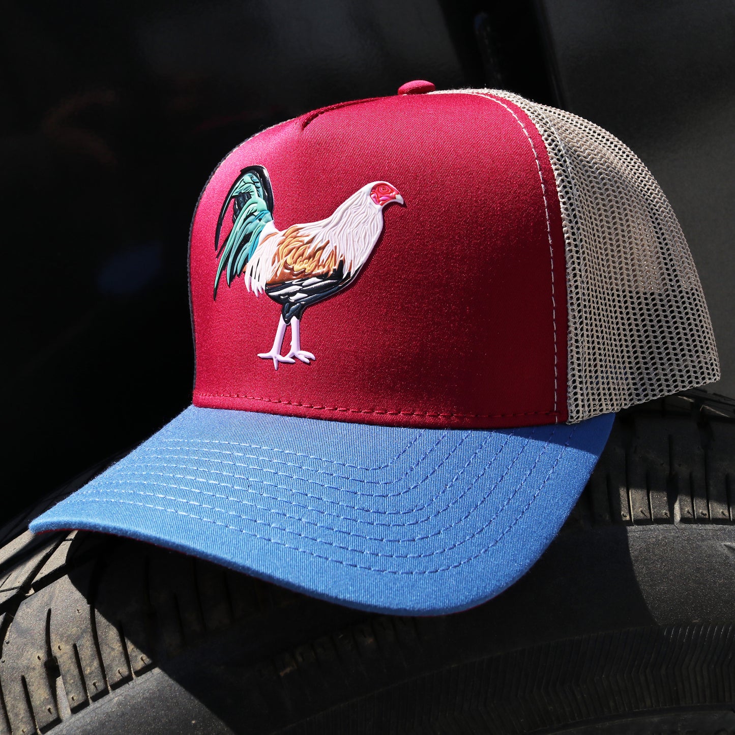 Gallo Giro AVC hat with maroon front, blue visor, khaki mesh back, and rooster emblem.