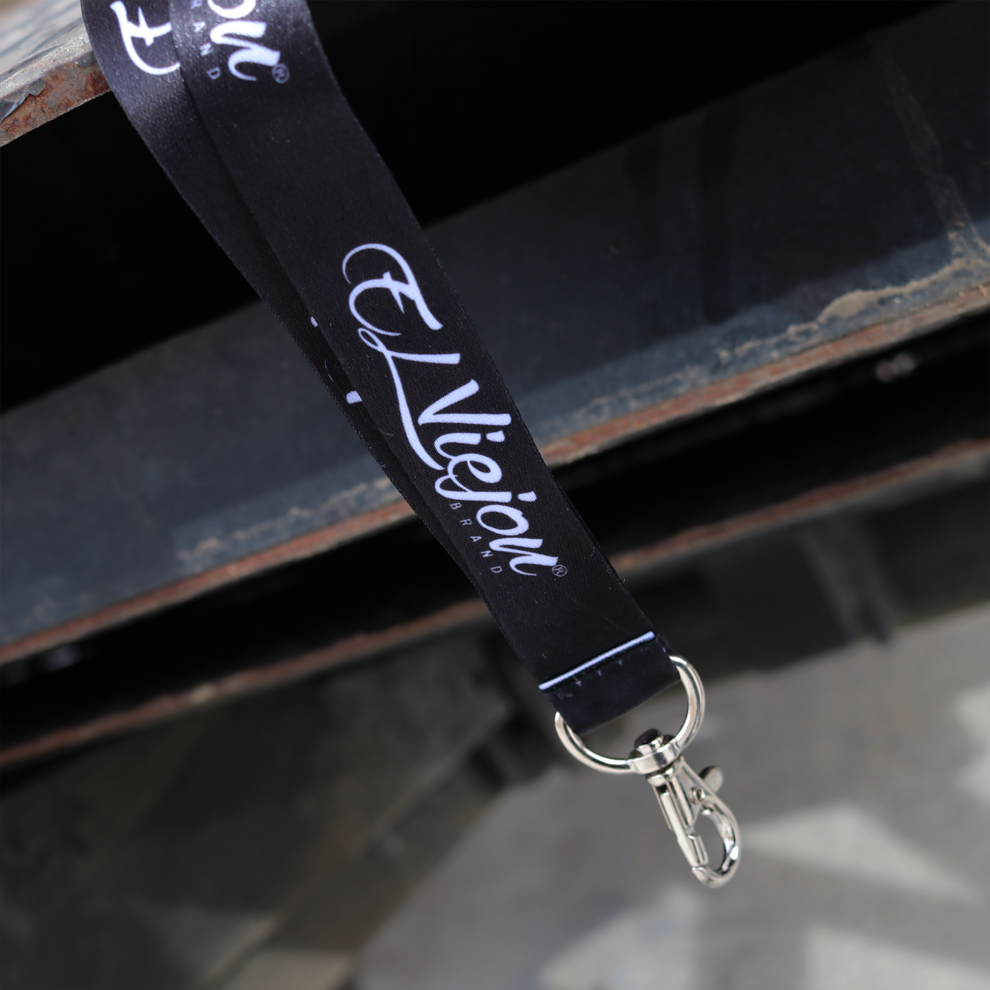 Black El Viejon brand lanyard with white script logo and silver metal clasp.
