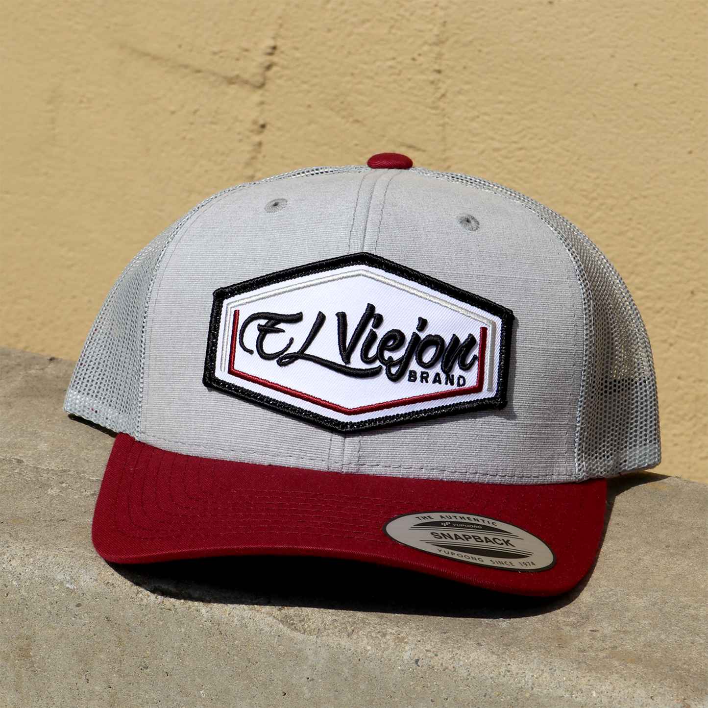 Calibre Maroon/Grey/Grey classic trucker hat with "El Viejon Brand" patch and snapback.
