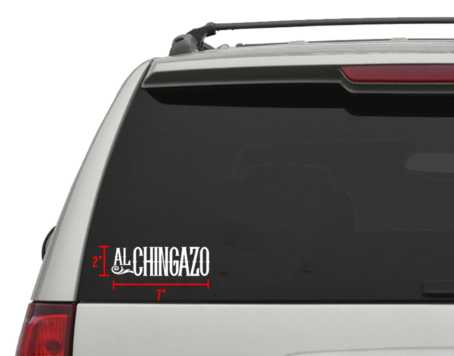 White "Al Chingazo" die-cut sticker, 7"x 2", applied to a car's rear window.