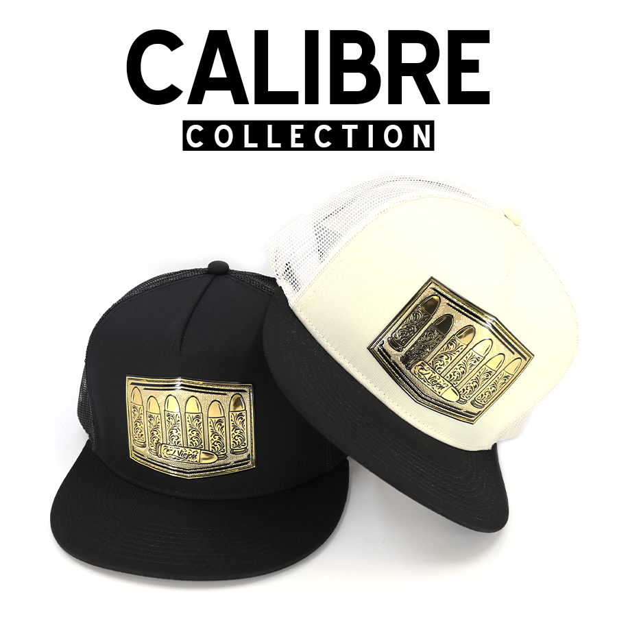 Black and cream trucker hats with gold bullet-themed patches from the Calibre Collection.