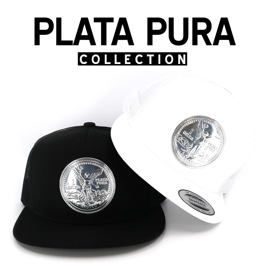 Plata Pura™ Collection: Black and white trucker hats with shiny silver coin emblems.