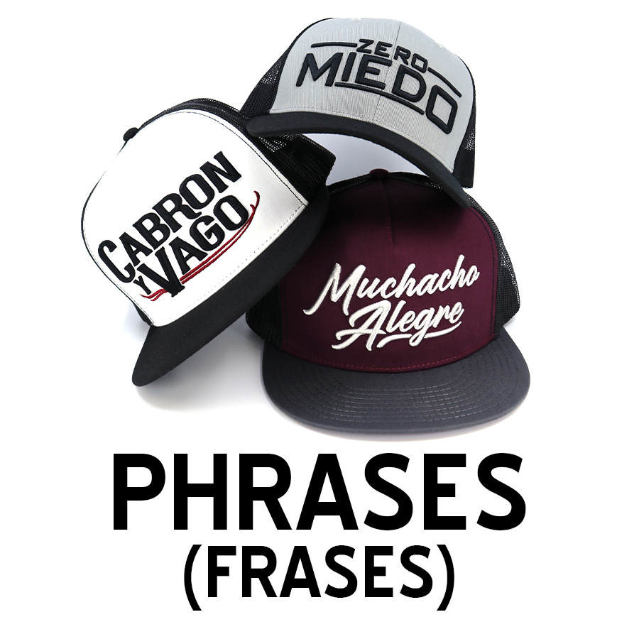 Three trucker hats with embroidered Spanish phrases: "Cabron Vago," "Zero Miedo," and "Muchacho Alegre.