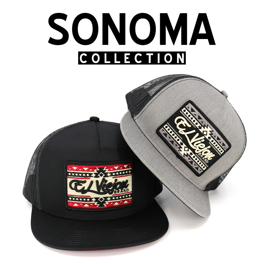 Two Sonoma Collection trucker hats: one black with a red and white patterned patch, one gray with a black and white patch.
