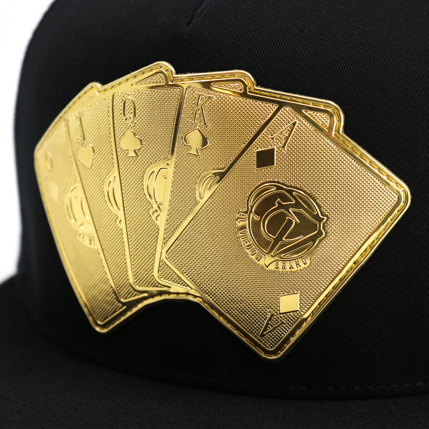 Baraja De Oro Black flat visor hat with gold playing card emblem.