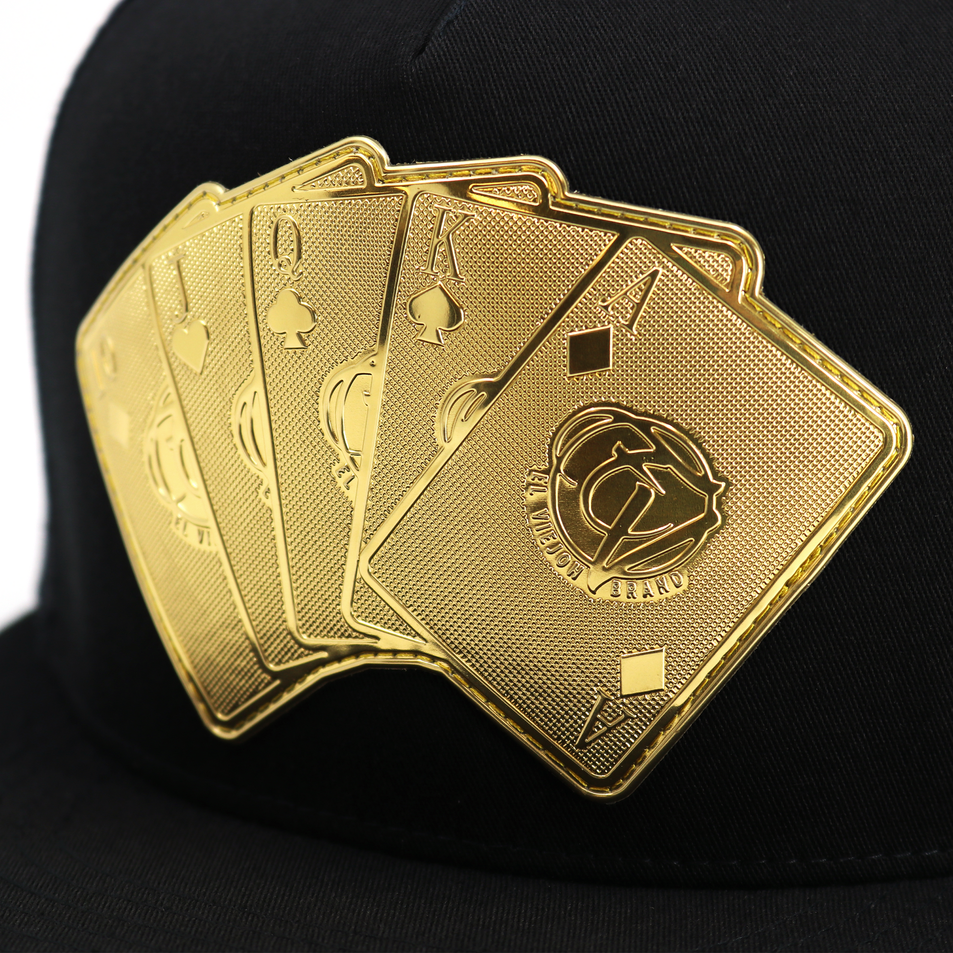Baraja De Oro Black flat visor hat with gold playing card emblem.