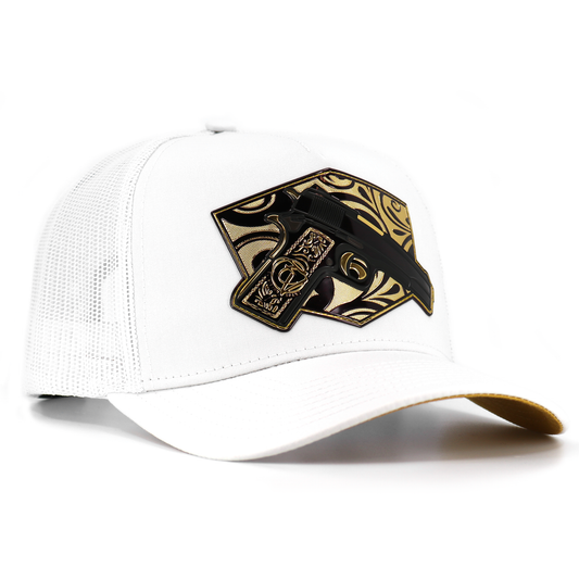 Cachas de Oro White AVC hat with a black and gold gun emblem on the front.