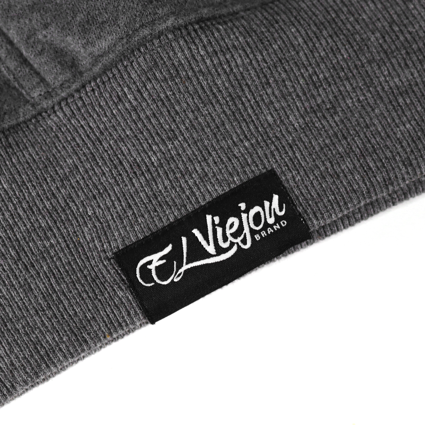 Close-up of a dark heather gray cotton/poly fleece hoodie with a black "El Viejou Brand" label.