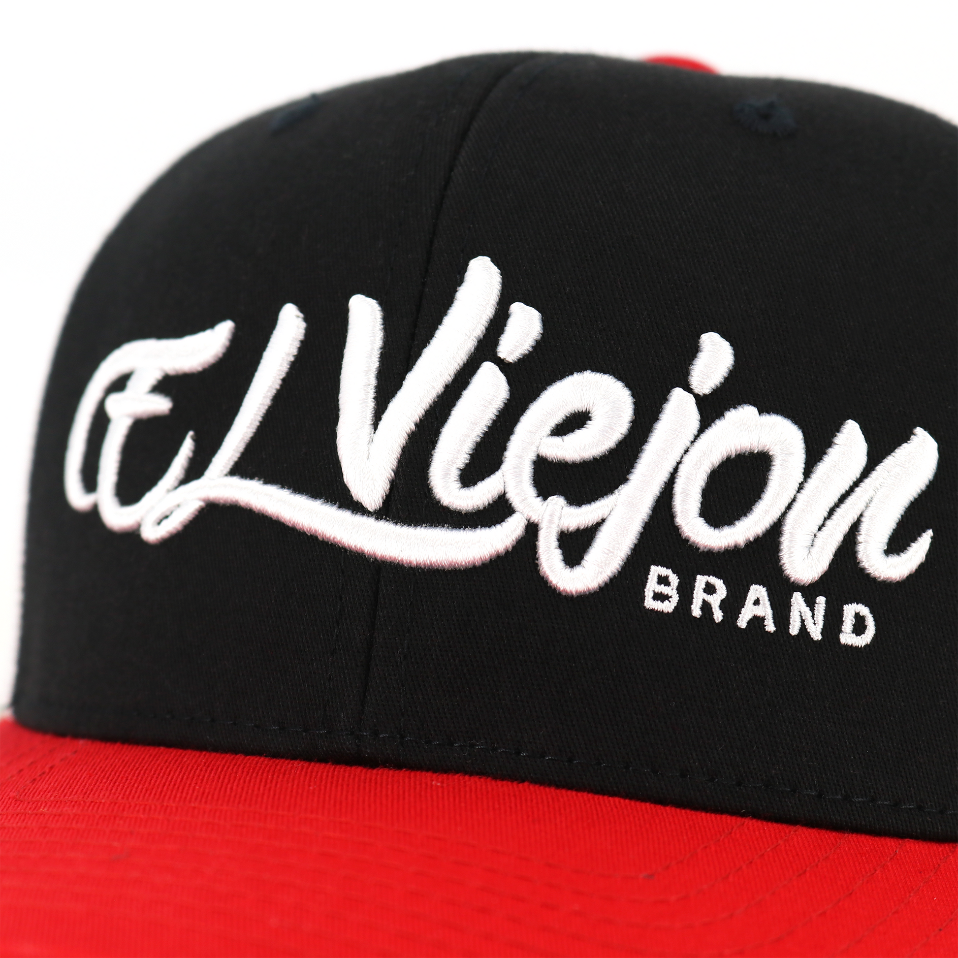 La Original Red/Black/White classic visor hat with "El Viejon Brand" embroidered in white.