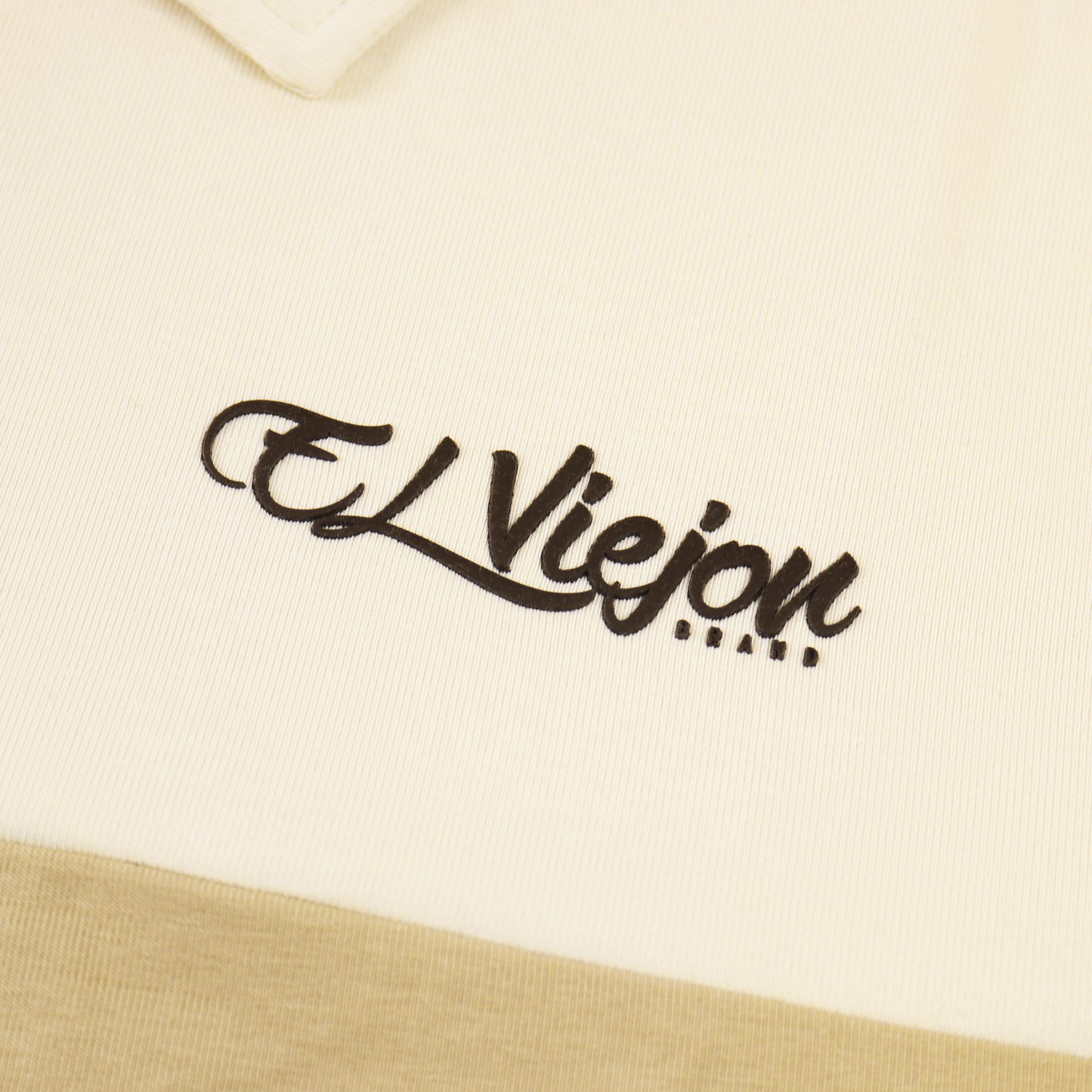 Cream/sand polo shirt with a black 3D "El Viejon Brand" logo, 96% cotton, 4% spandex material.
