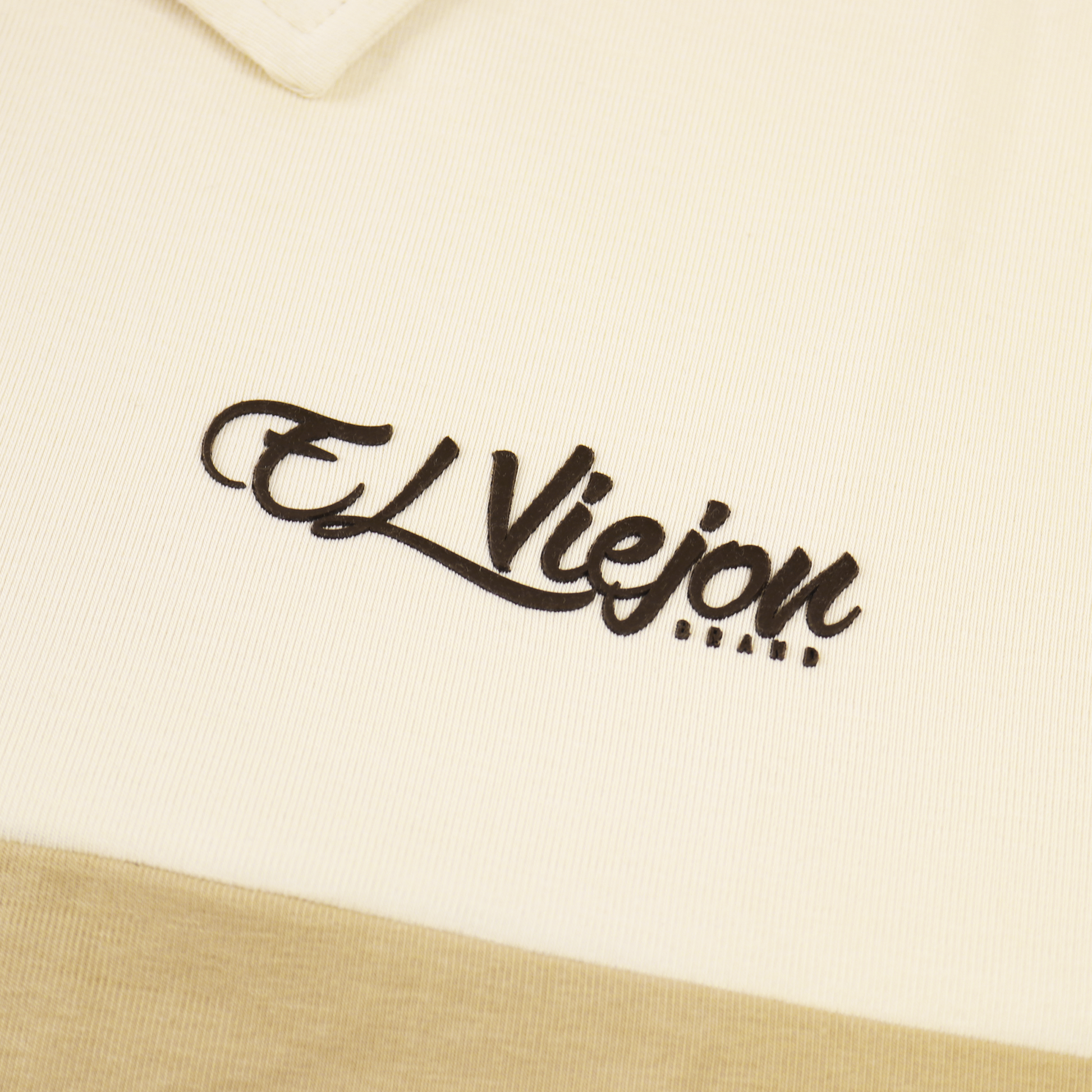 Cream/sand polo shirt with a black 3D "El Viejon Brand" logo, 96% cotton, 4% spandex material.