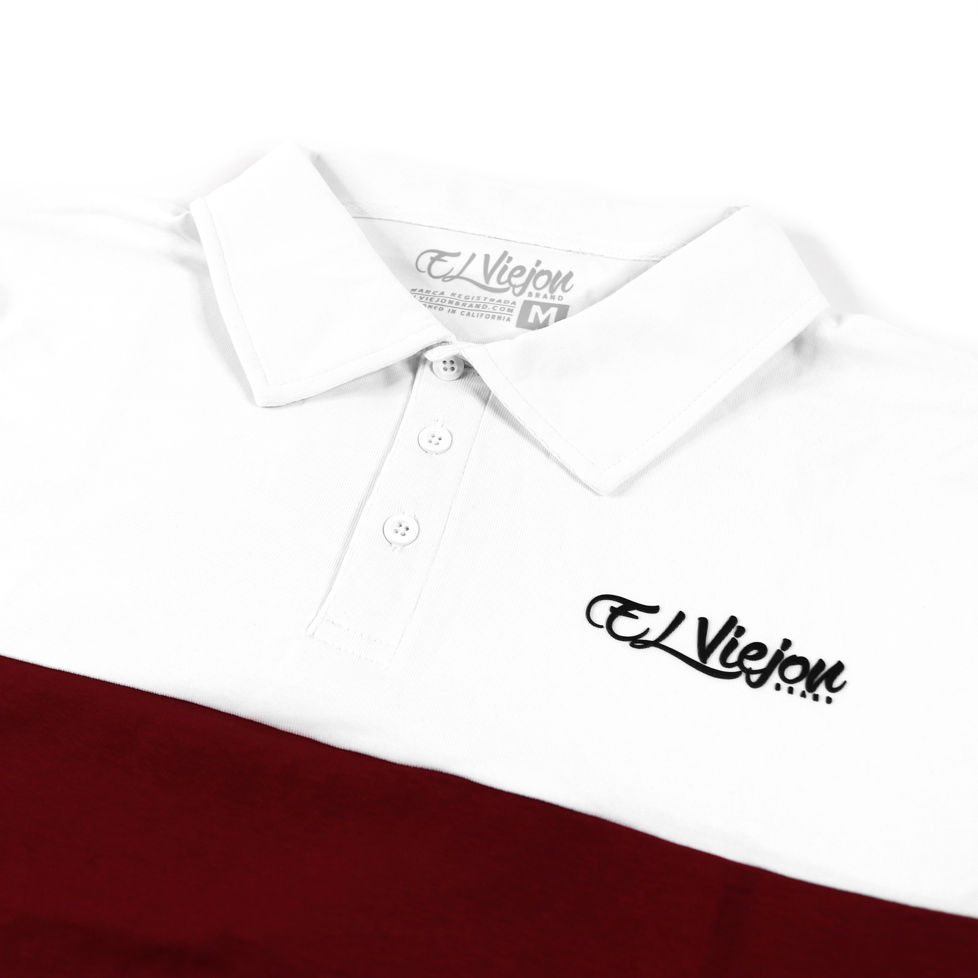 White and maroon polo shirt with a 3-button placket and black 3D "El Viejon Brand" logo.