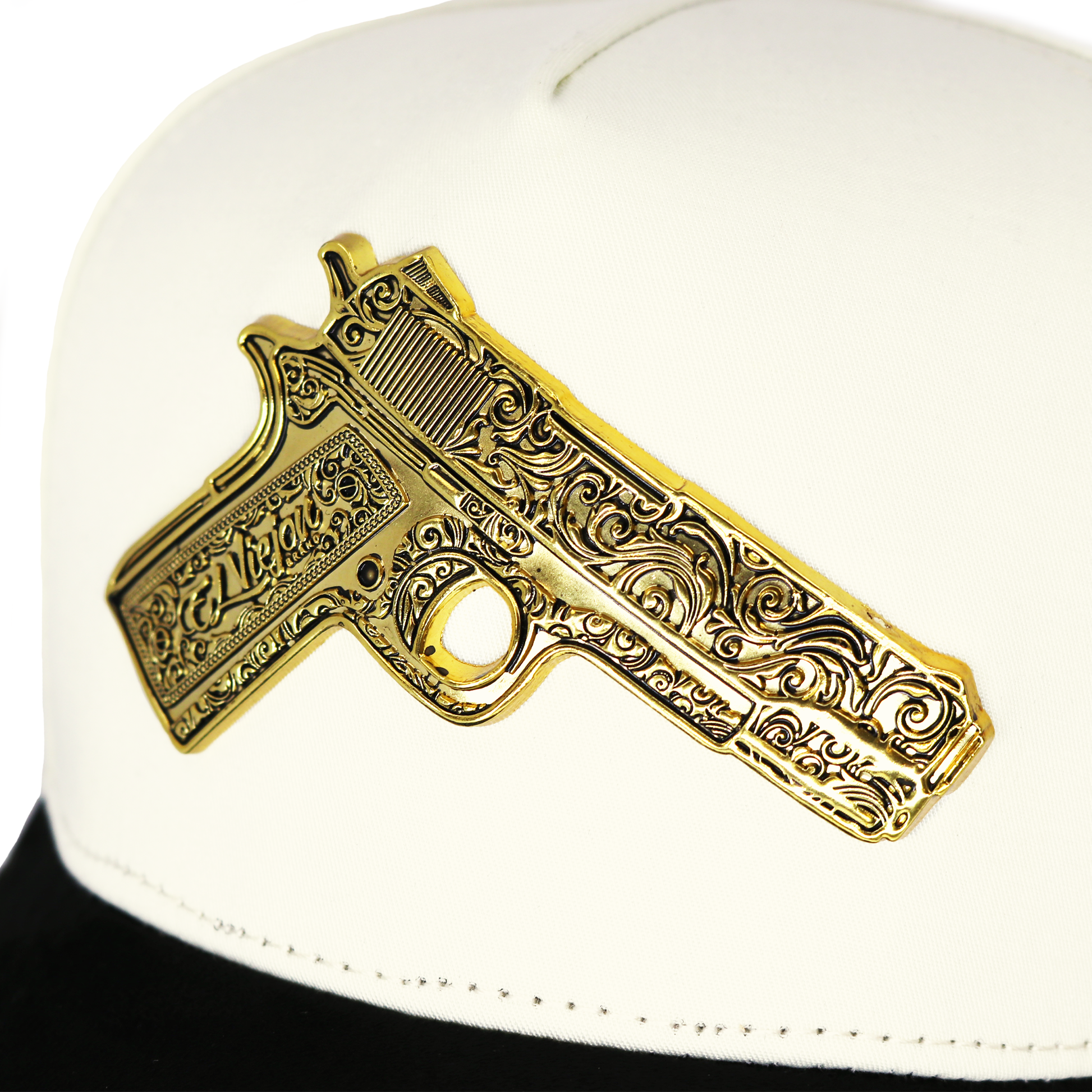 White cap with a gold gun-shaped emblem on a white background