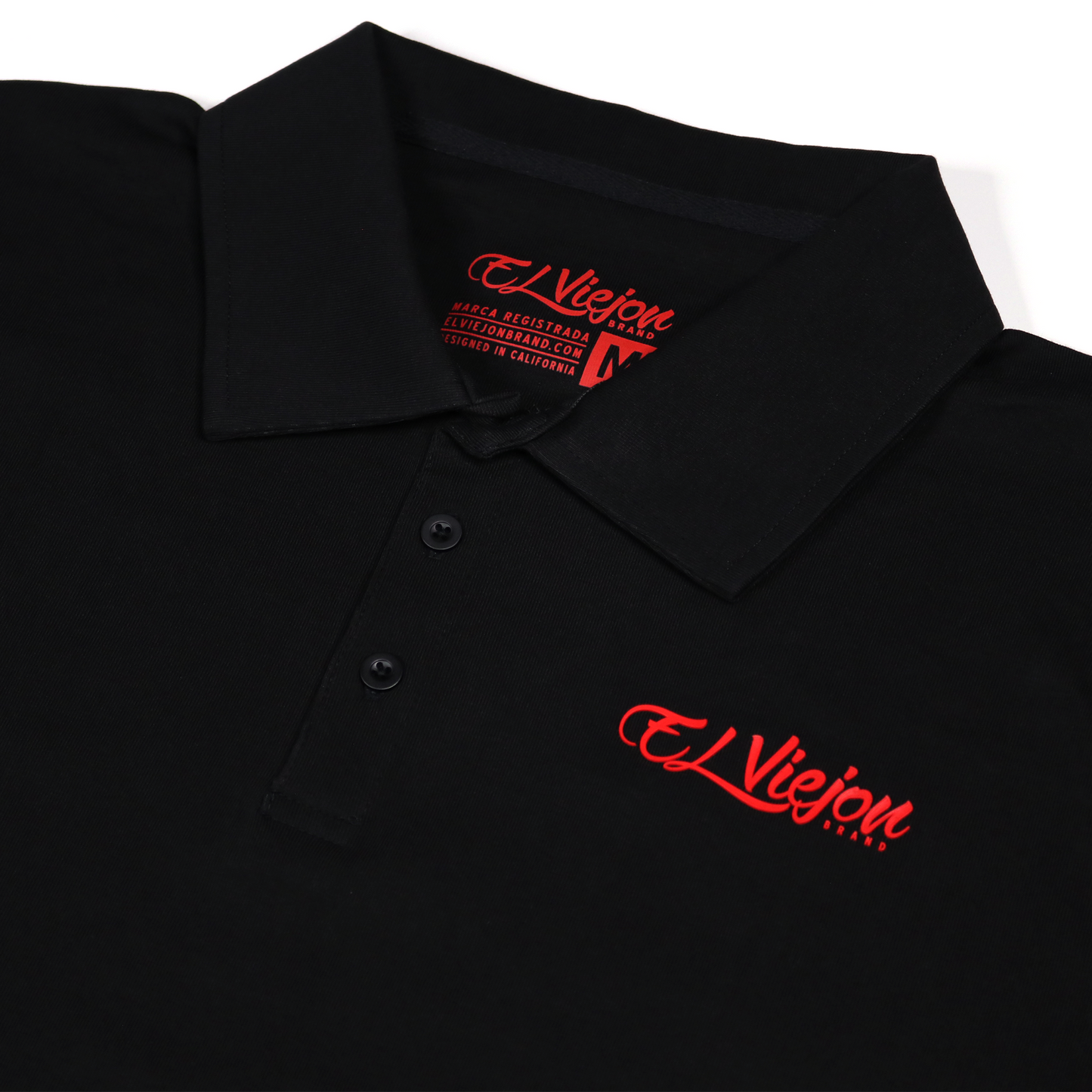 Black polo shirt with red "El Viejon Brand" 3D vinyl logo, 3-button placket, and collared neck.