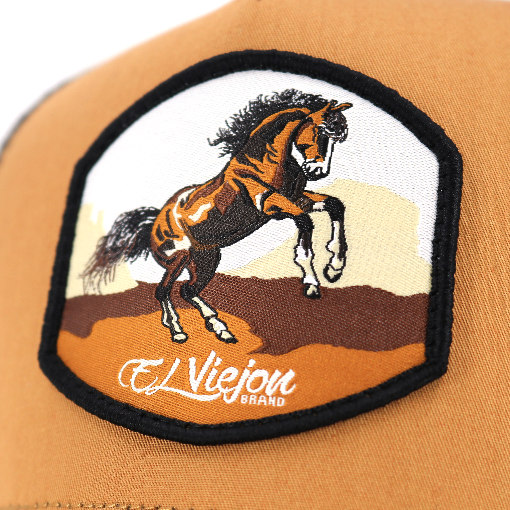 Bailador Caramel/Black AVC hat with a rearing horse patch, high profile, and pre-curved visor.
