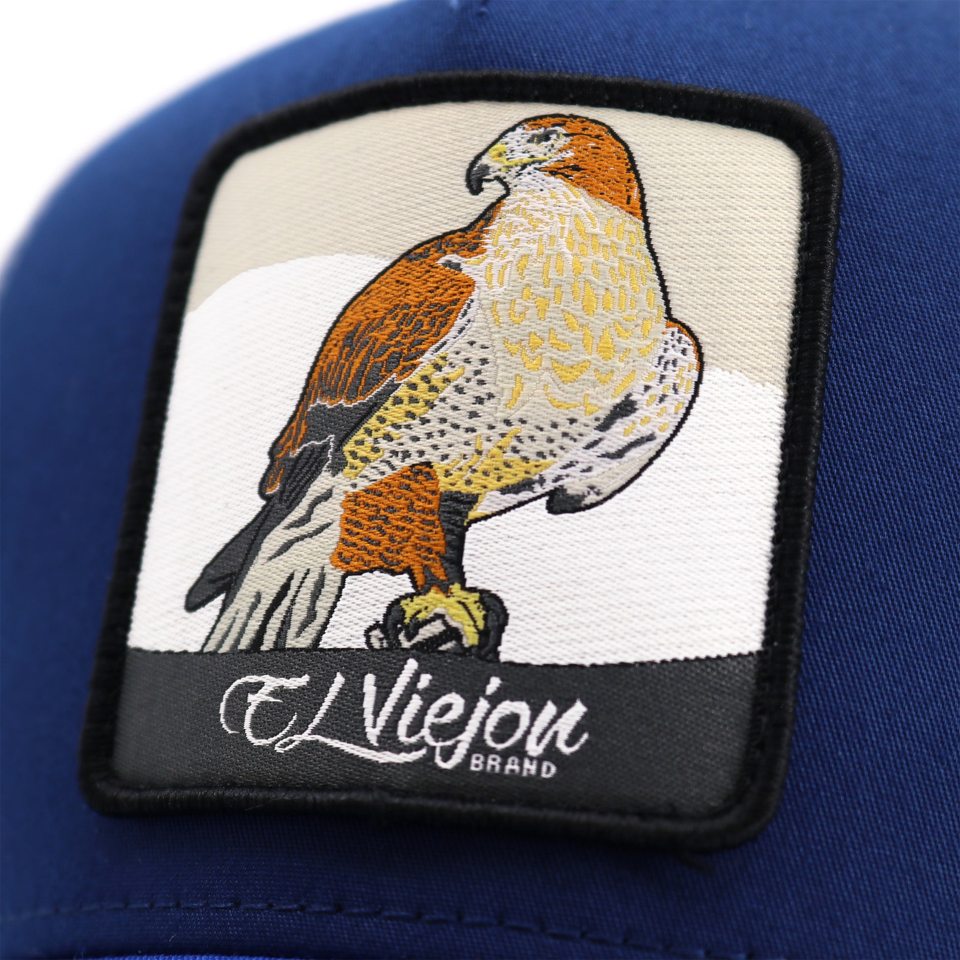 Halcon Blue/Navy/White AVC hat with a detailed falcon patch and "El Viejou Brand" text.