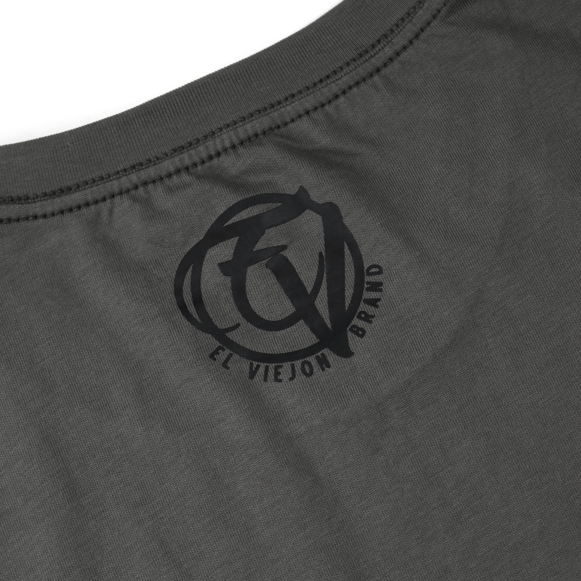 Charcoal gray 100% cotton Medieval shirt with a black screen-printed "El Viejon Brand" logo on the back collar.