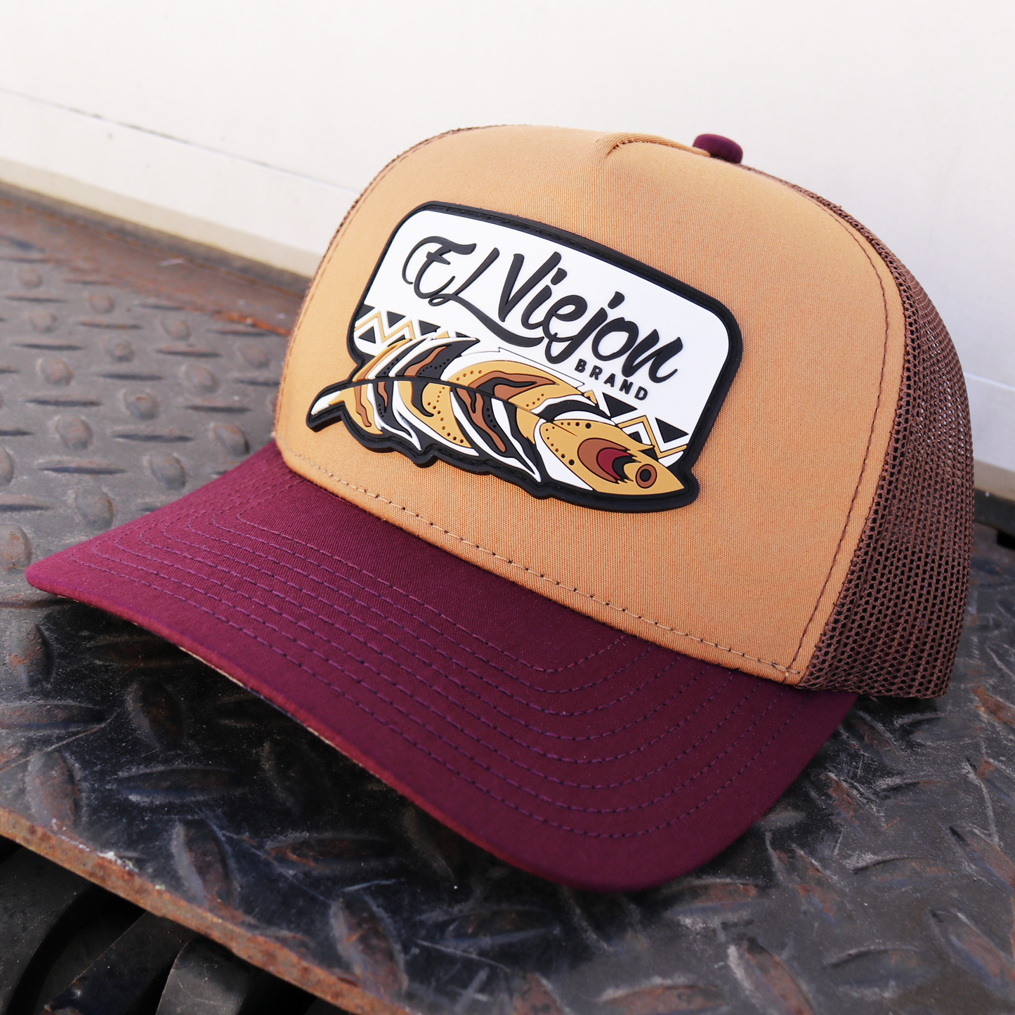 Nativo maroon, camel, and brown AVC hat with El Viejon Brand fish logo, mesh back, and snapback.