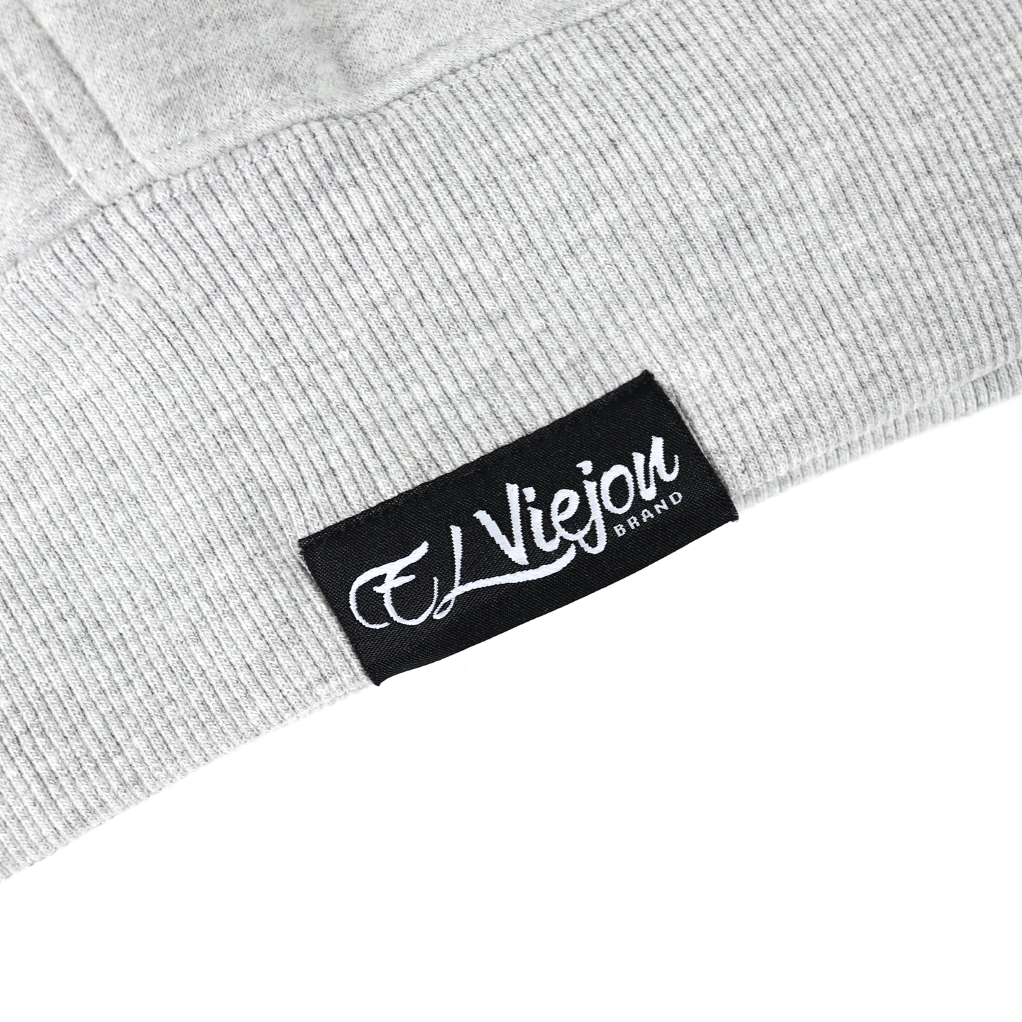 Close-up of a gray heather cotton/poly fleece hoodie with a black "El Viejou Brand" label.