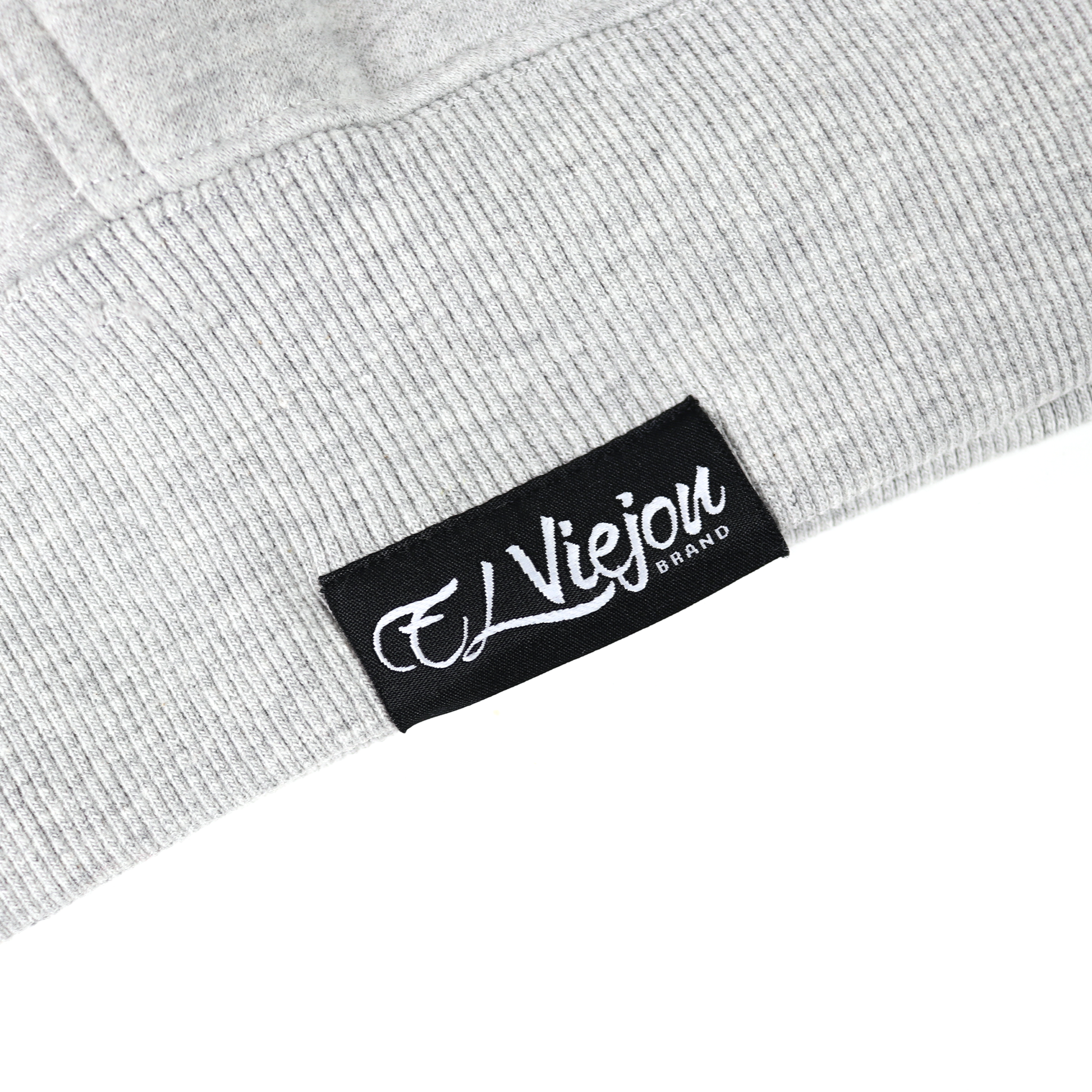 Close-up of a gray heather cotton/poly fleece hoodie with a black "El Viejou Brand" label.