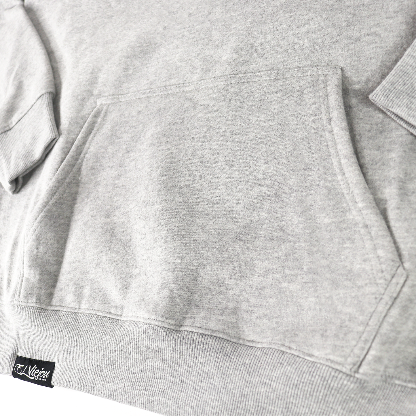 Origen heather cotton/poly fleece hoodie with front pocket and "El Viejon" logo tag.