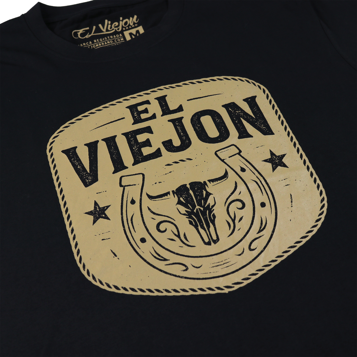Black Rancho Viejo cotton shirt with a tan "El Viejon" logo featuring a bull skull and horseshoe design.