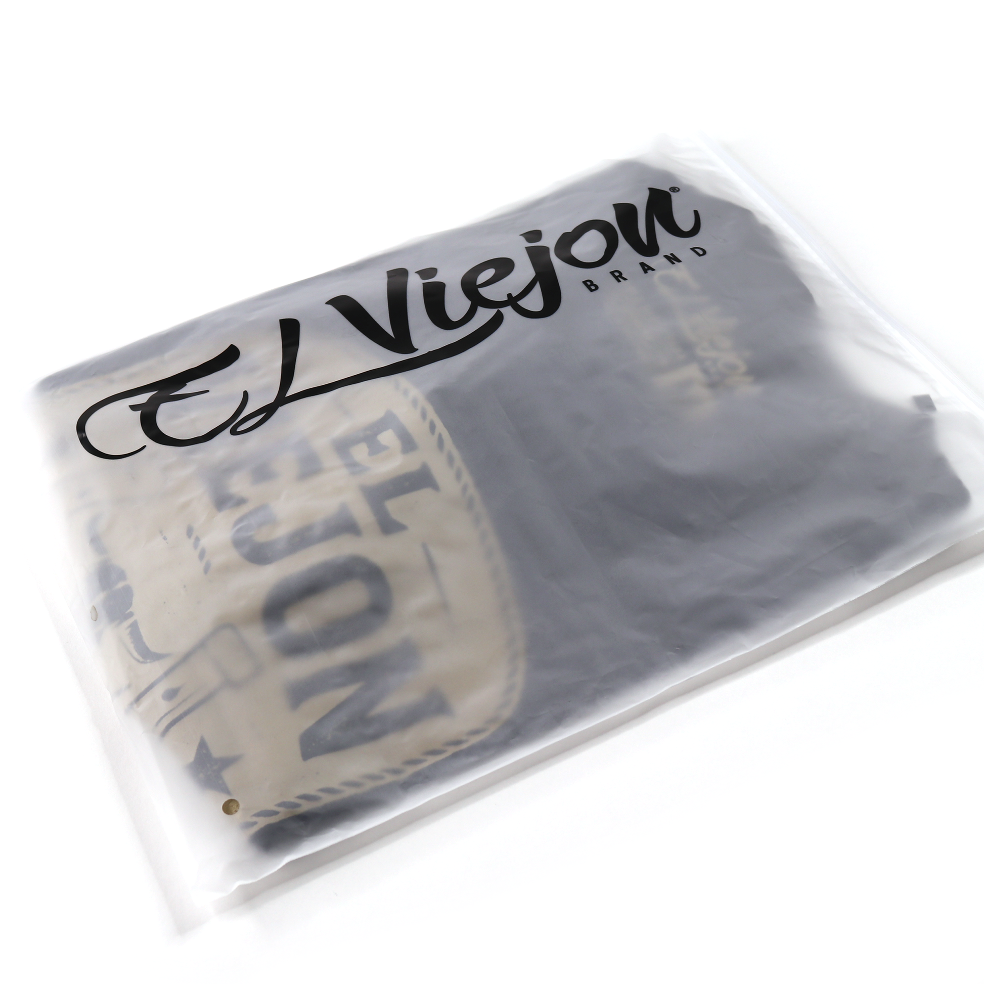 Rancho Viejo black 100% cotton shirt with screen-printed logo, folded in a clear branded bag.