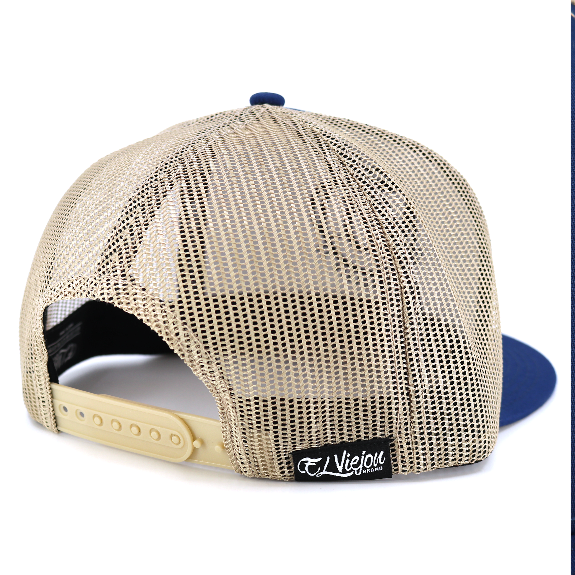 Rienda Navy/Tan flat visor hat with tan mesh back and adjustable snapback.