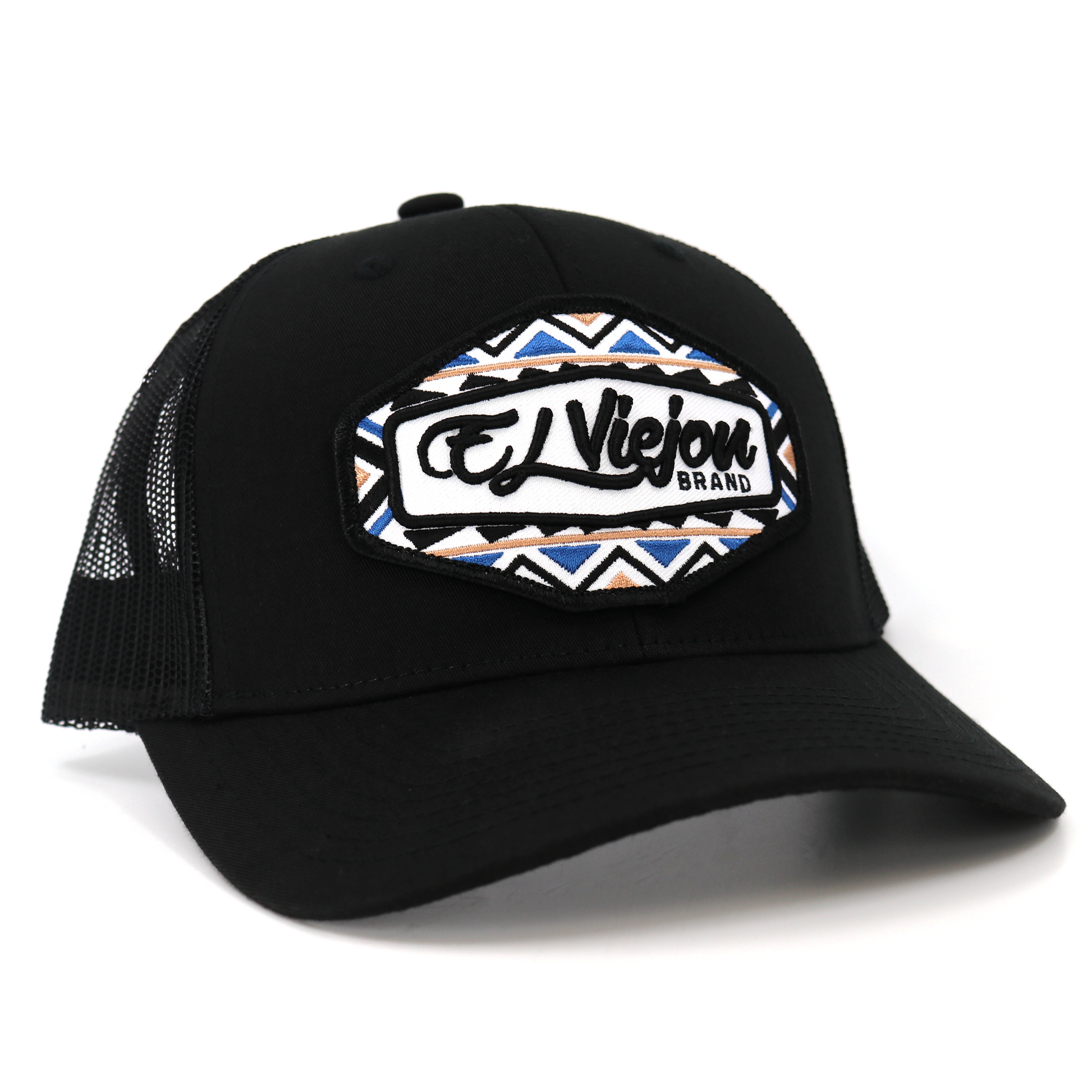 Black TruCap trucker hat with mesh back, pre-curved visor, and "El Viejou Brand" patch with geometric pattern.