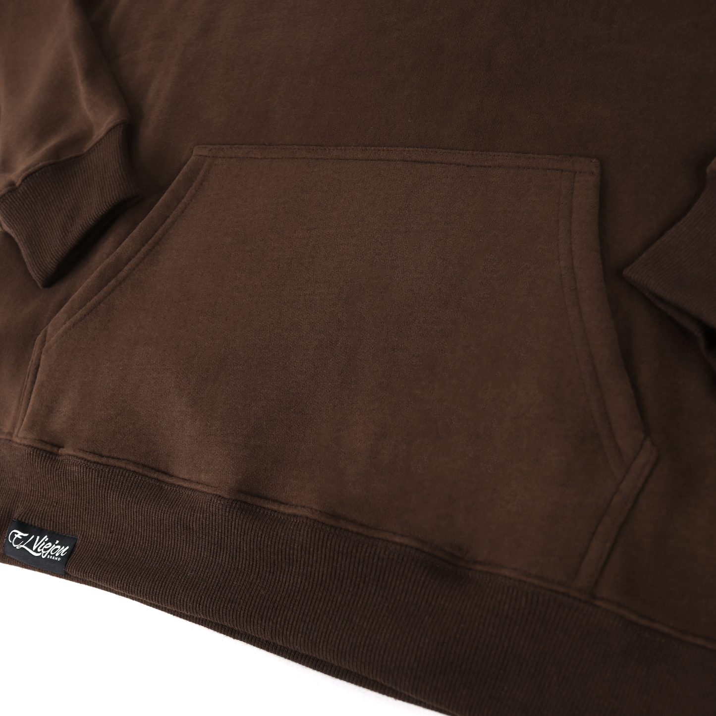 Alpha brown cotton/poly fleece hoodie with front pocket and small black logo tag on the bottom left.