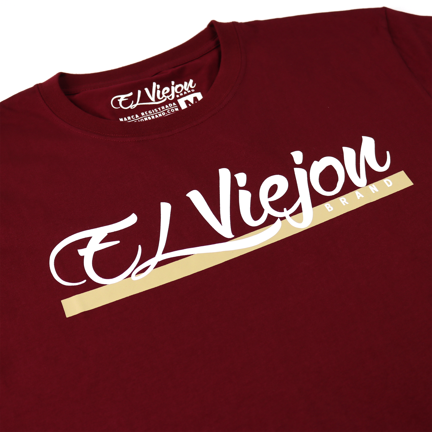 Maroon Alpha shirt with white "El Viejon" script and "BRAND" in gold on 100% cotton.
