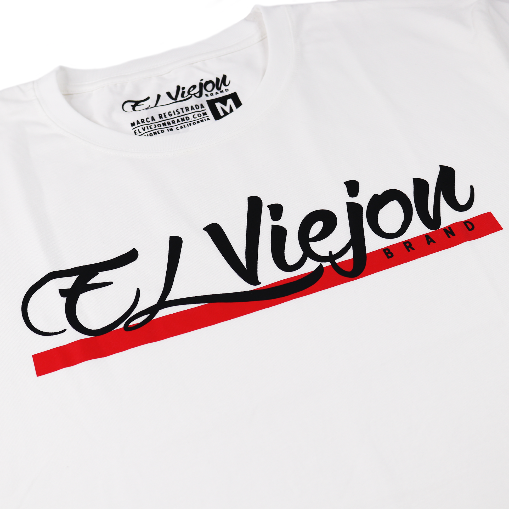 White 100% cotton Alpha shirt with black and red "El Viejon Brand" screen-printed logo.