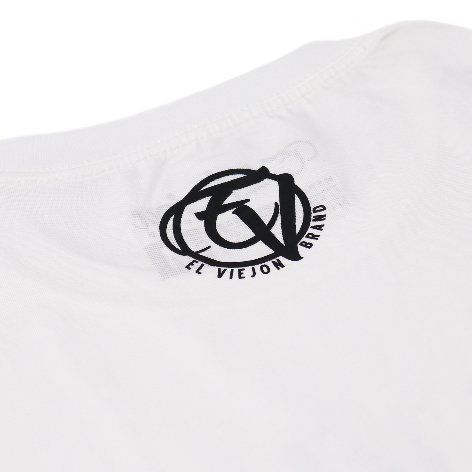White 100% cotton Alpha Shirt with black screen-printed "El Viejon Brand" logo on the back collar.