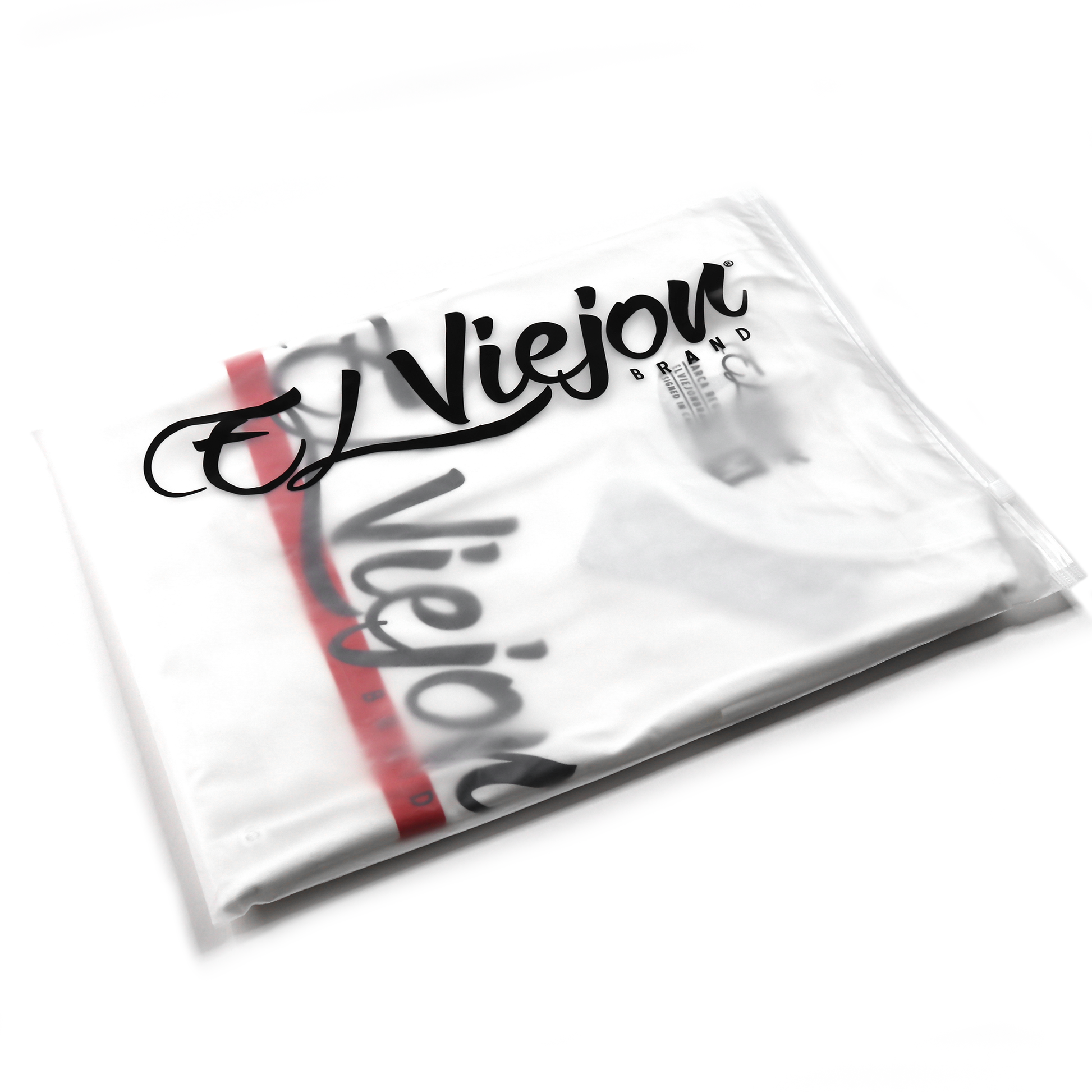 White Alpha Shirt in clear plastic packaging, showing black "El Viejou Brand" logo.