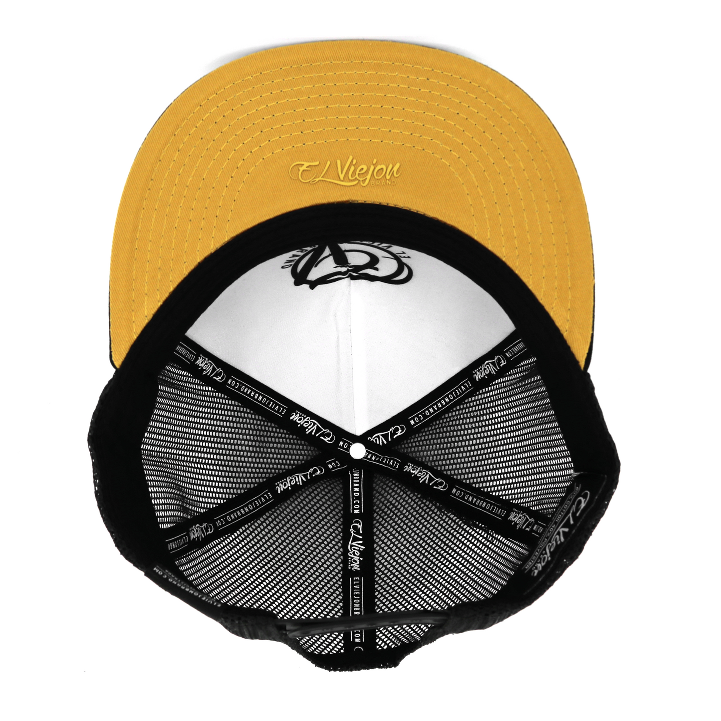 Cachas De Oro Black flat visor hat with gold underside, black mesh, and white interior.