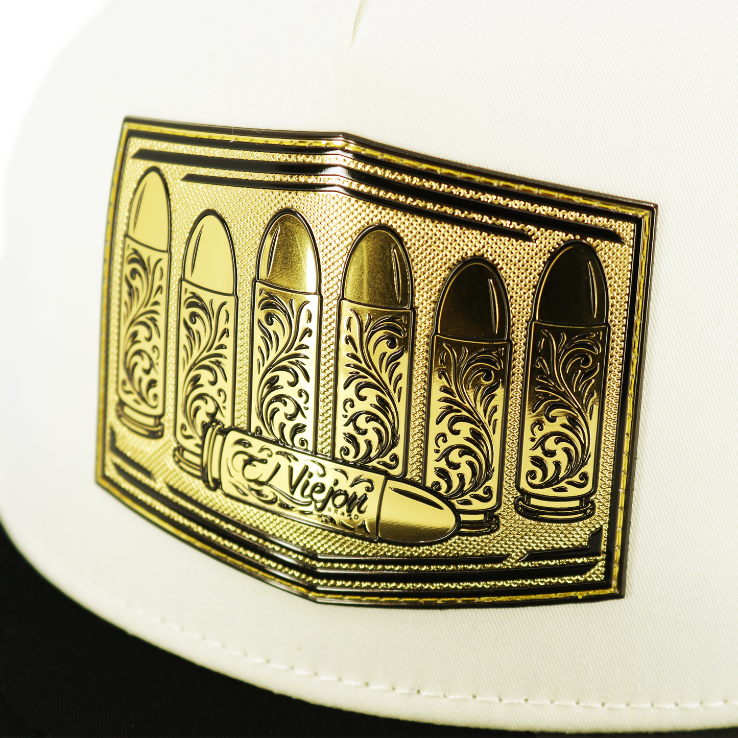 Calibre Black/Ivory flat visor hat with gold bullet emblem and "El Viejon" text.