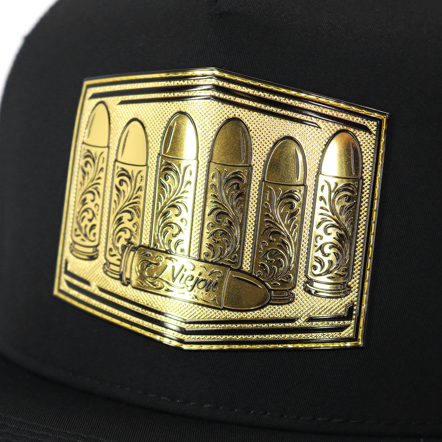 Calibre Black flat visor hat with a gold metallic patch featuring five ornate bullets and "Viejo" text.