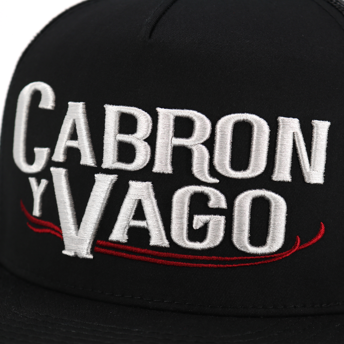 Cabron Y Vago black flat visor hat with silver embroidered logo and red accents.
