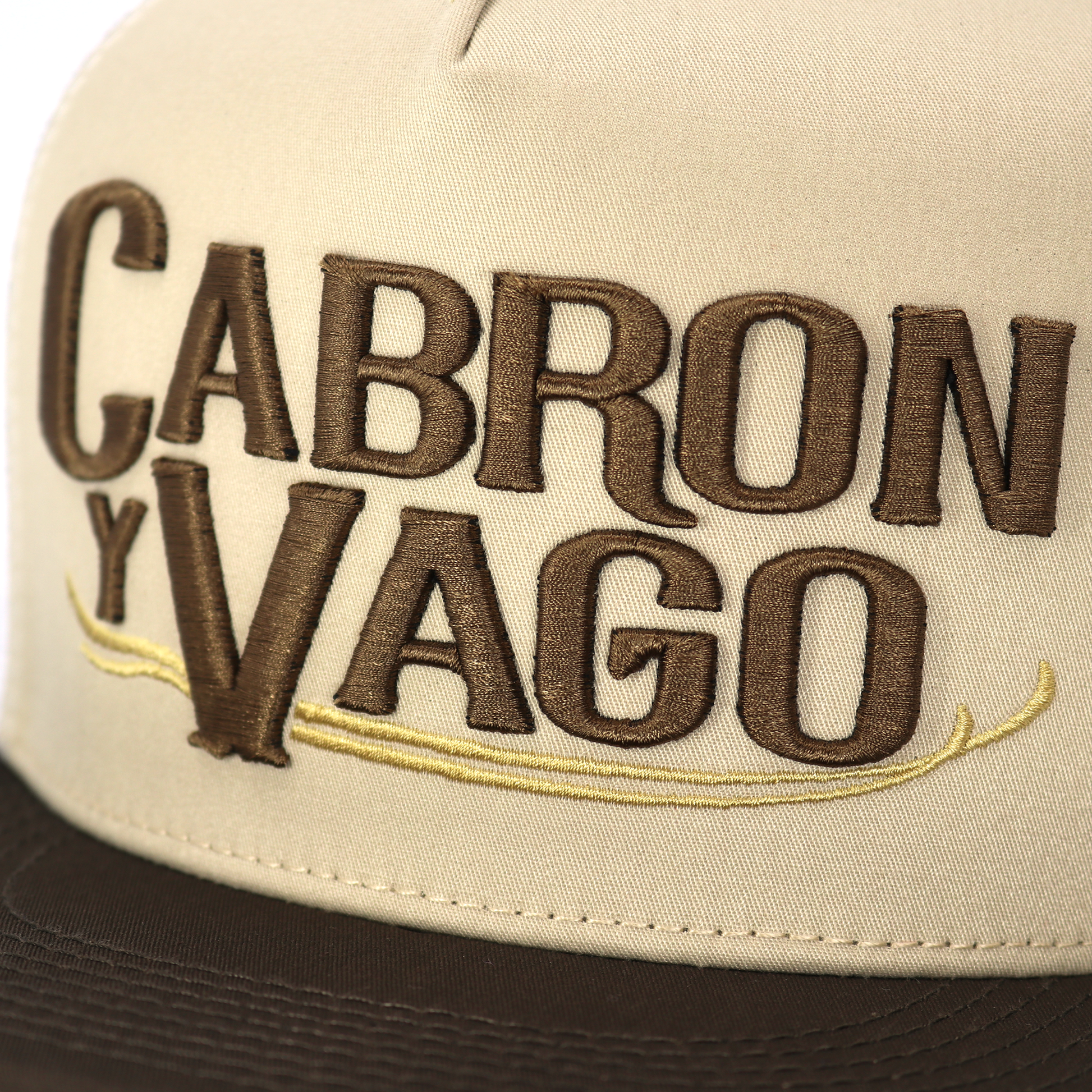 Beige cap with 'Cabron Y Vago' text in brown embroidery