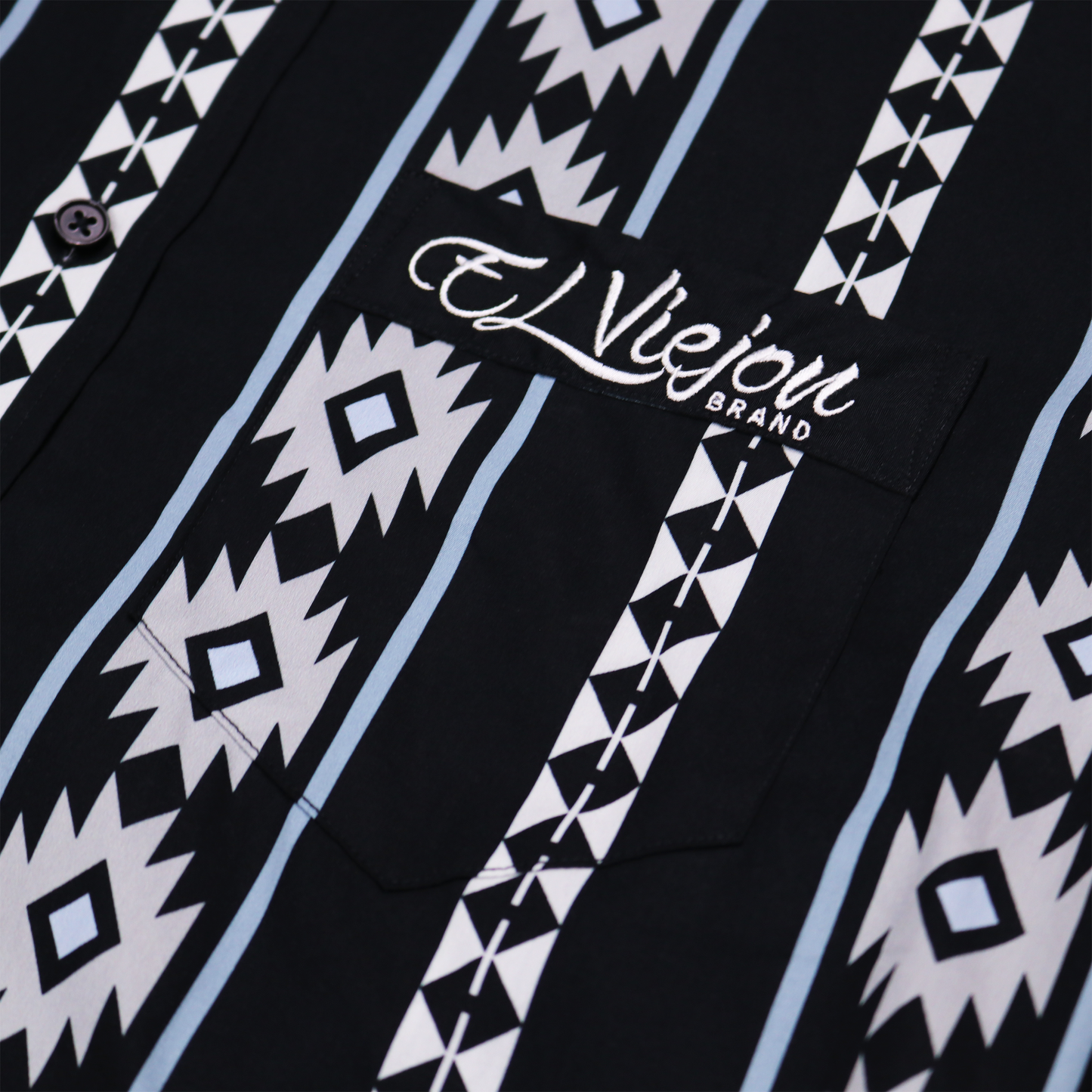 Cheyenne Black dress shirt with white and light blue geometric patterns, front pocket, and "El Viejon Brand" logo.