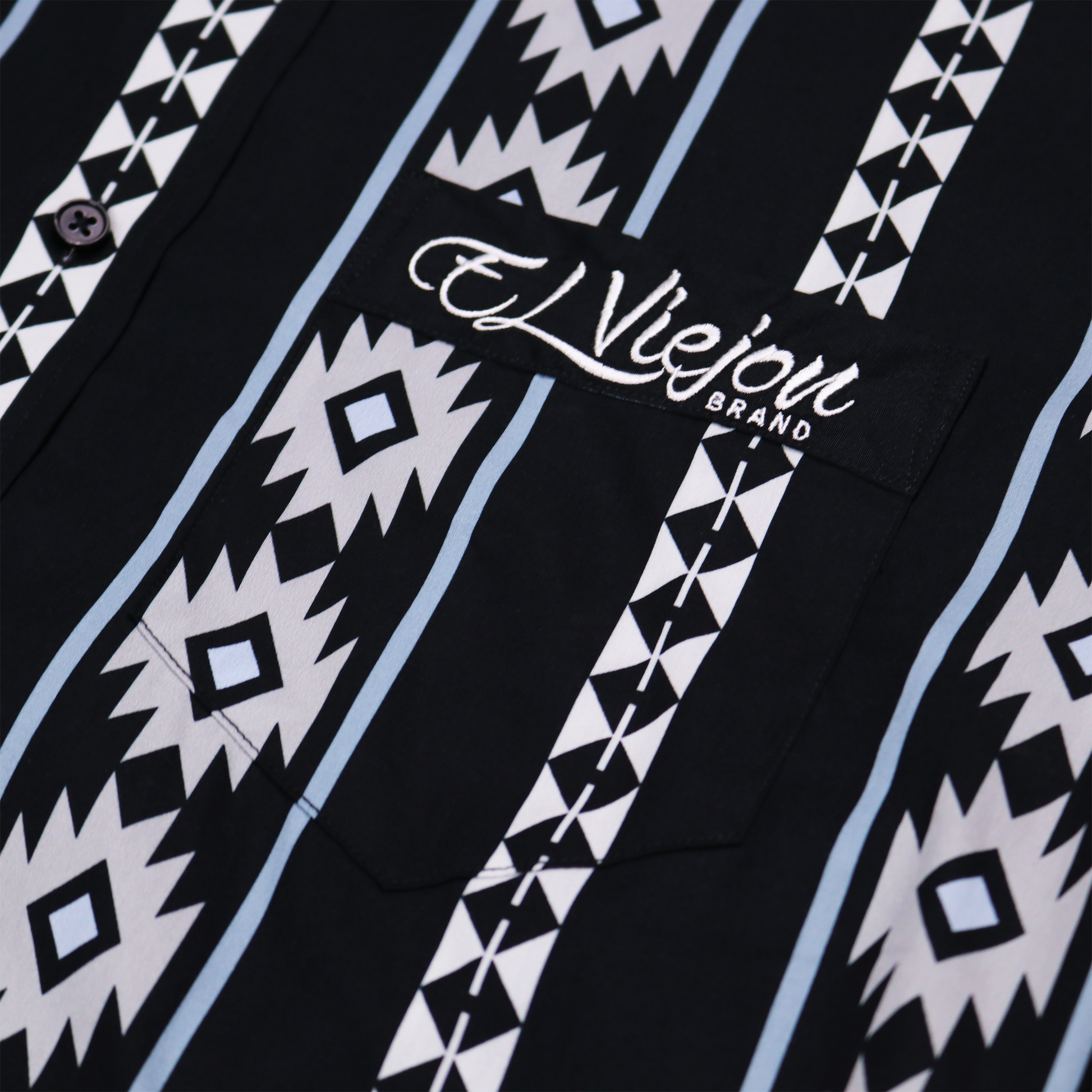Cheyenne Black dress shirt with white and light blue geometric patterns, front pocket, and "El Viejon Brand" logo.