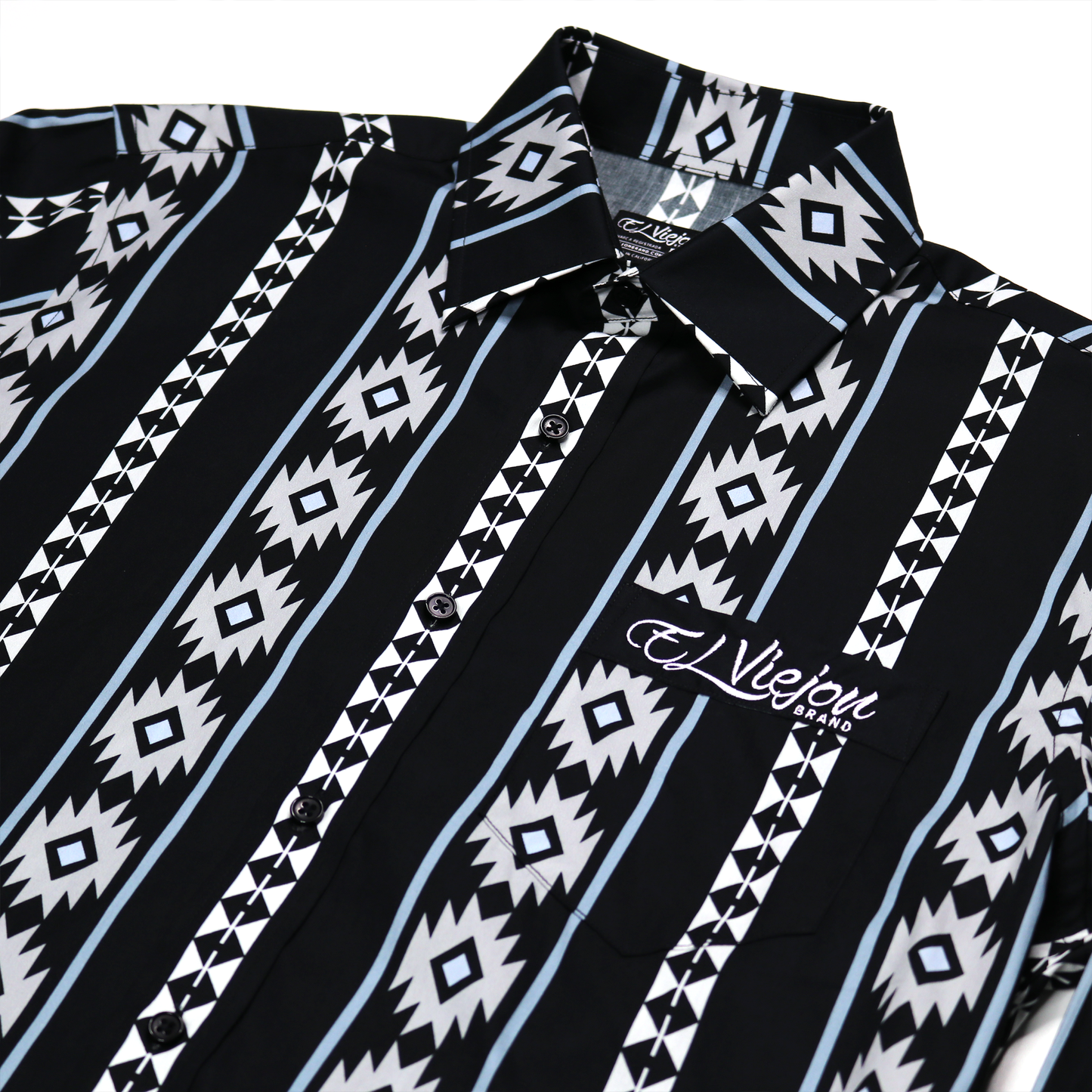 Cheyenne Black dress shirt with white, light blue, and gray geometric patterns, front pocket, and "El Viejon Brand" logo.