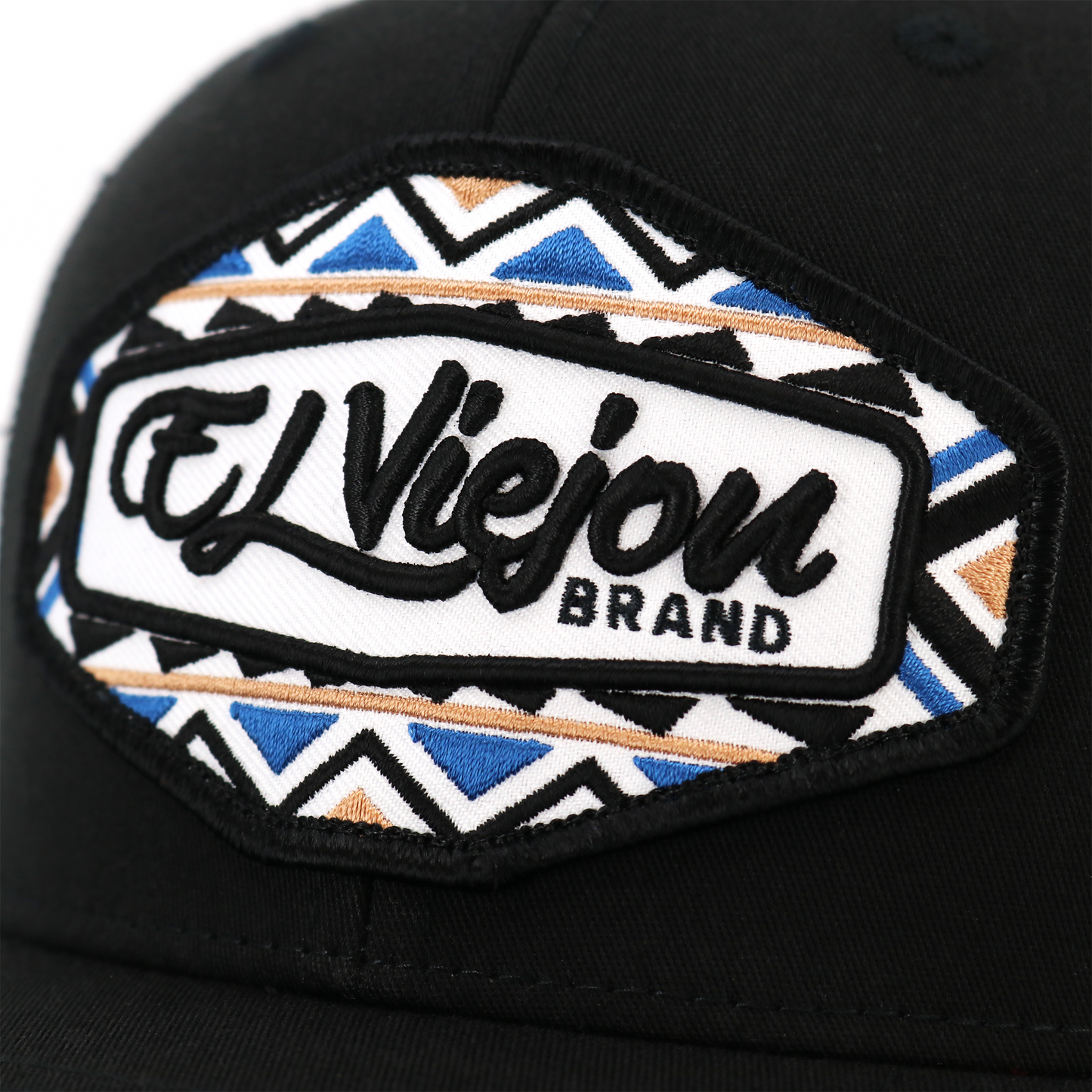Dakota Black TruCap trucker hat with "El Viejon Brand" embroidered patch, blue, black, and gold geometric pattern.