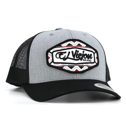 Dakota Yupoong Classic trucker hat: black mesh, heather gray front, black visor, "El Viejon Brand" patch.