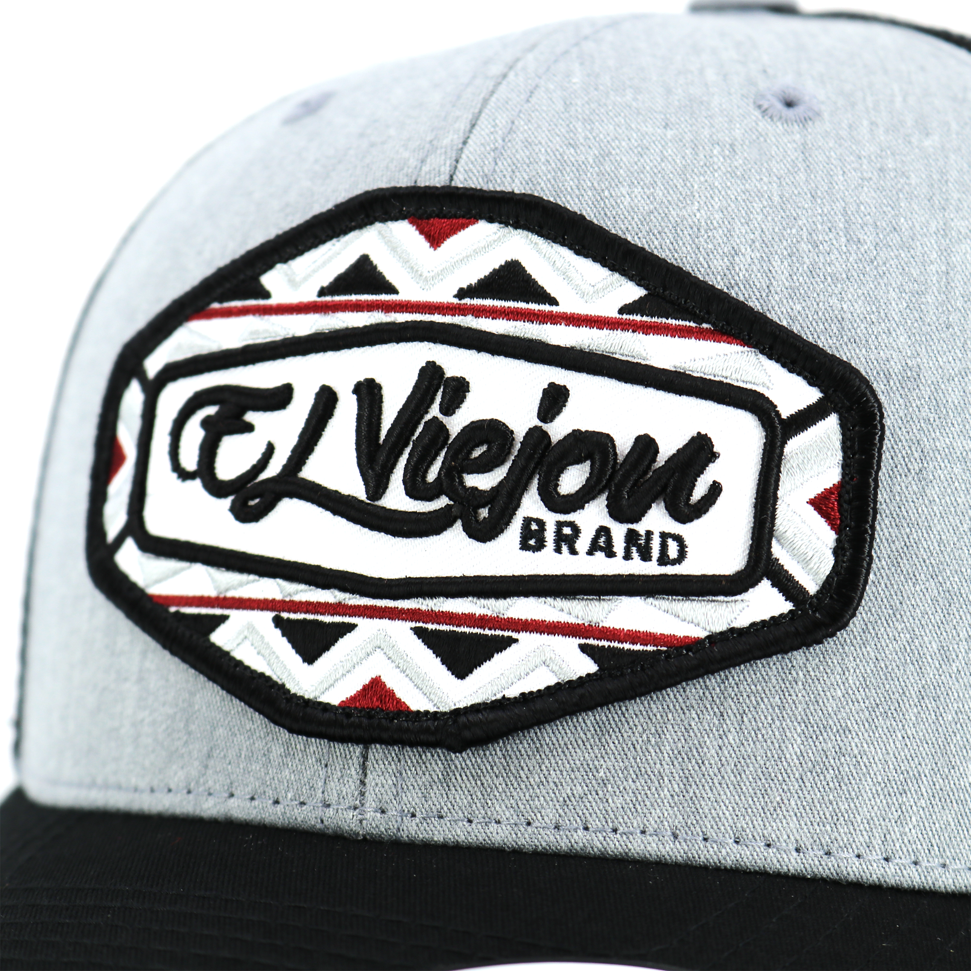 Dakota™ Black/Heather/Black Yupoong Classic™ trucker hat with "El Viejon Brand" patch.