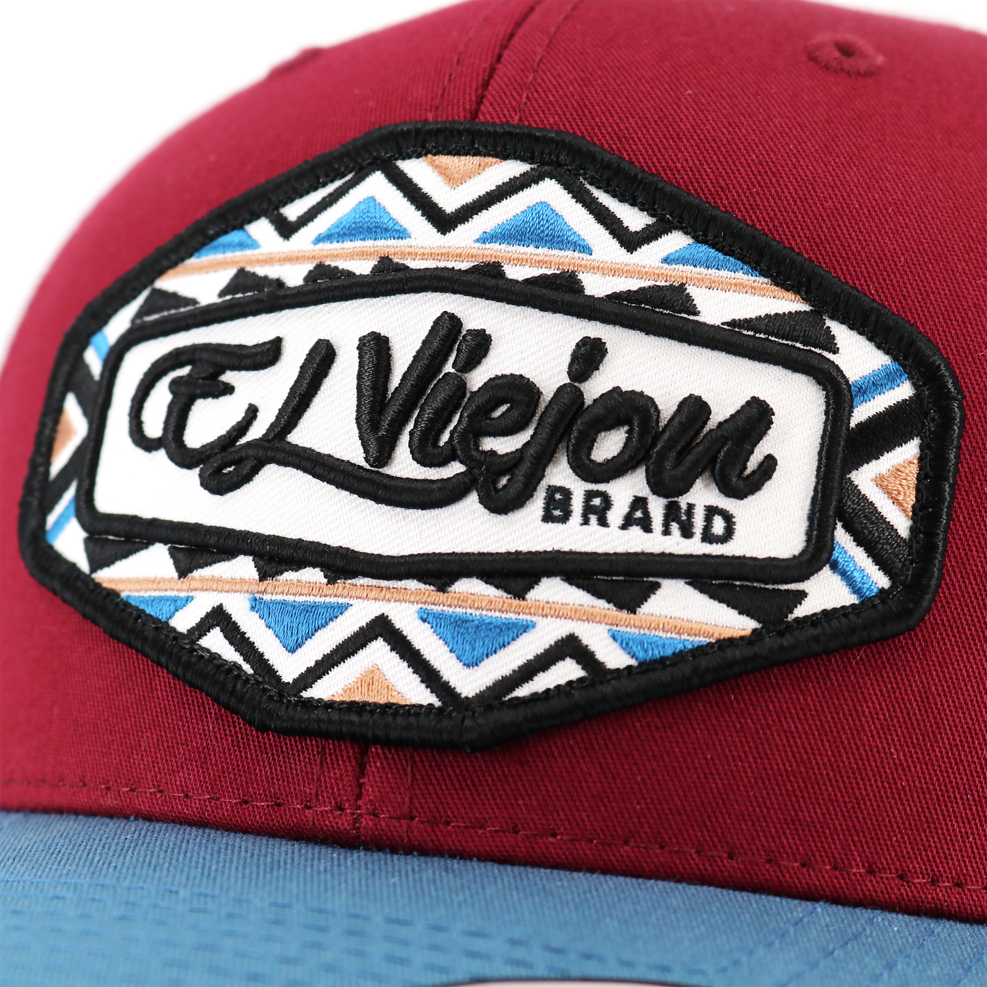 Dakota Indigo/Maroon/White classic visor hat with "El Viejon Brand" patch and geometric pattern.