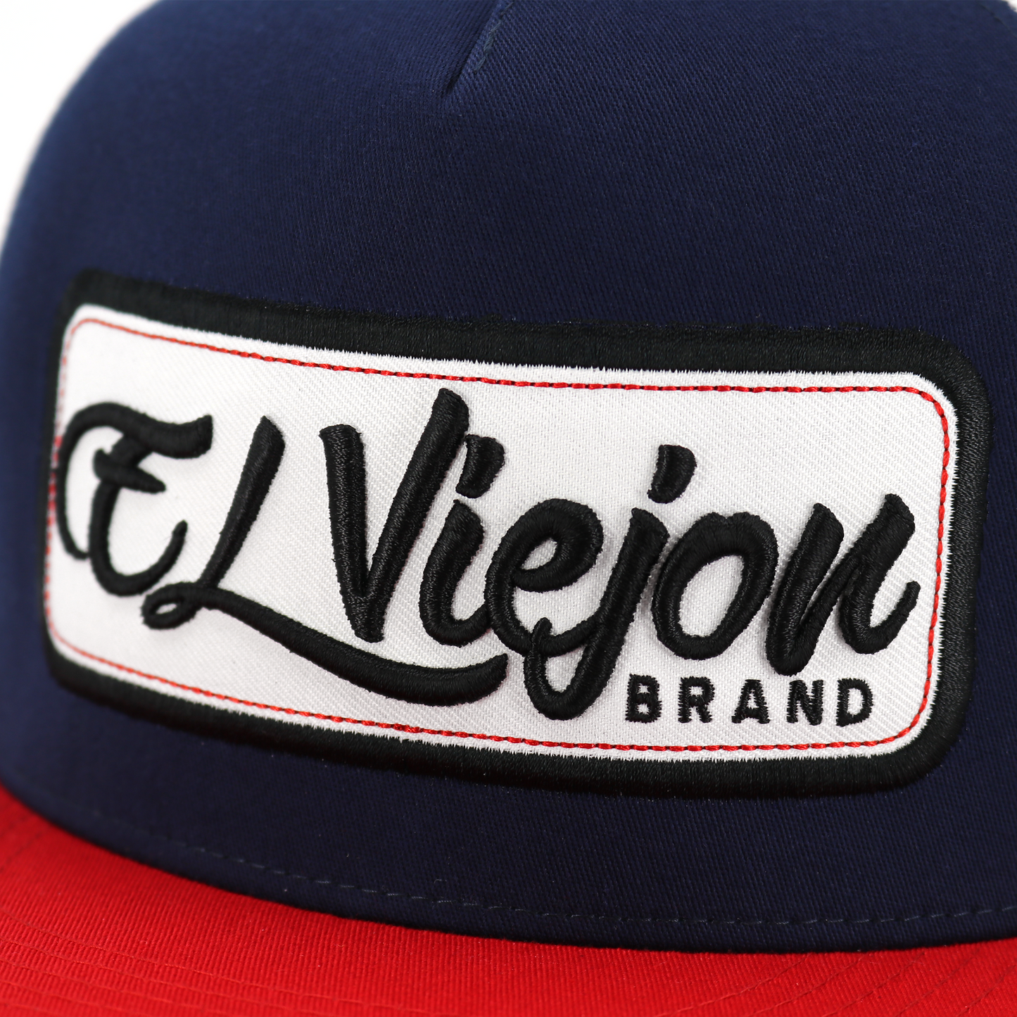 EV Patch Red/Navy/White flat visor trucker hat with "El Viejon Brand" embroidered patch.