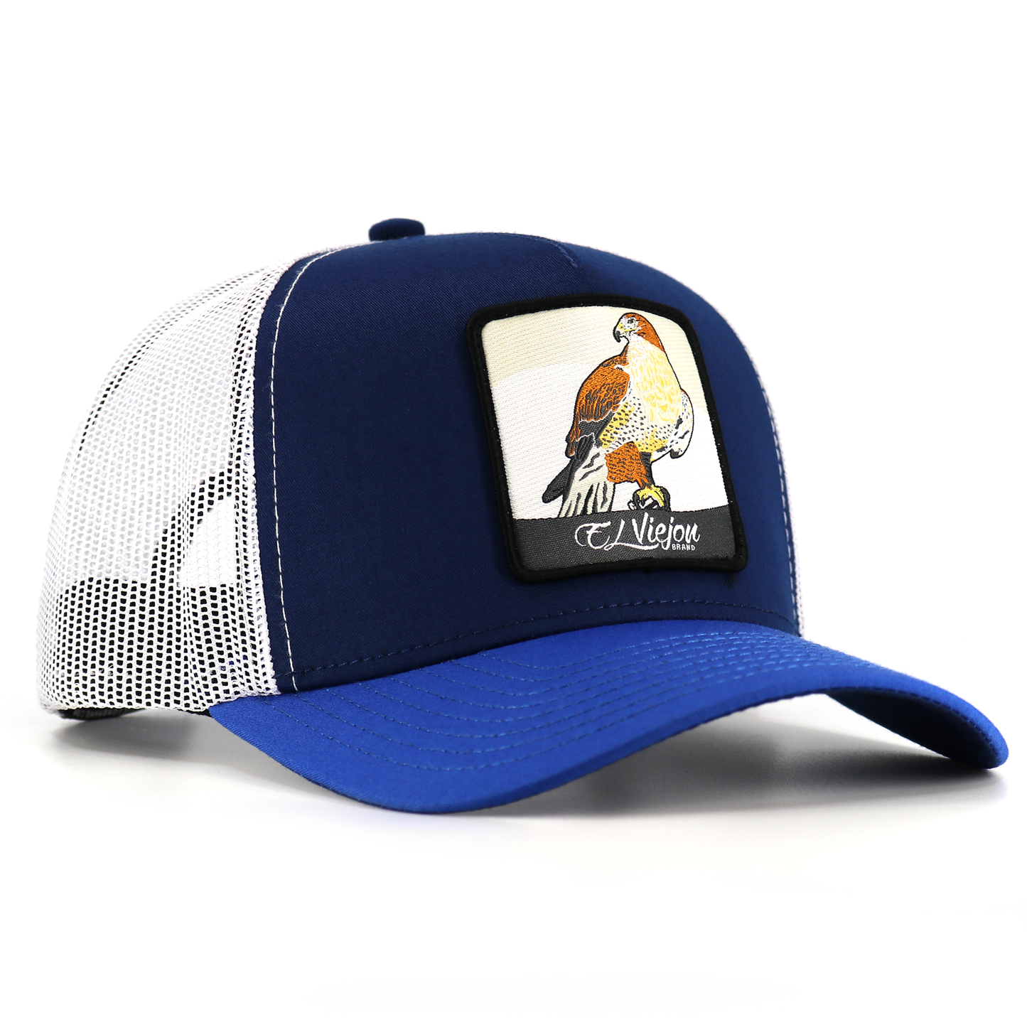 Halcon Blue/Navy/White AVC hat with a hawk patch, white mesh, and blue pre-curved visor.