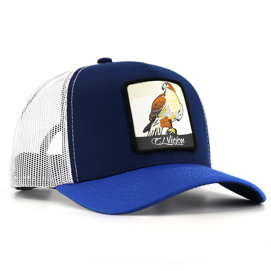Halcon Blue/Navy/White AVC hat with a hawk patch, white mesh, and blue pre-curved visor.