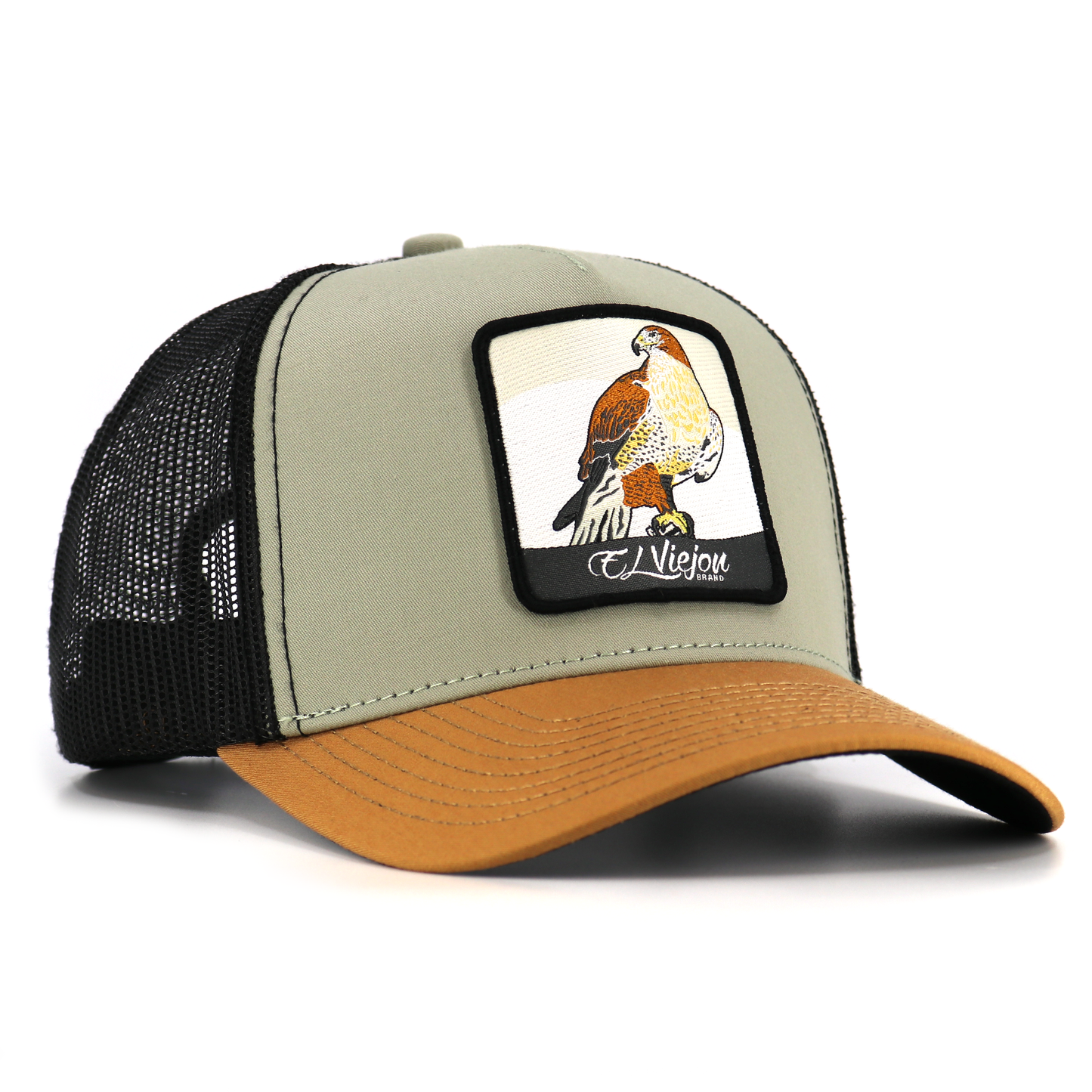 Halcon Camel/Tope/Black AVC hat with a hawk patch, pre-curved visor, and black mesh back.